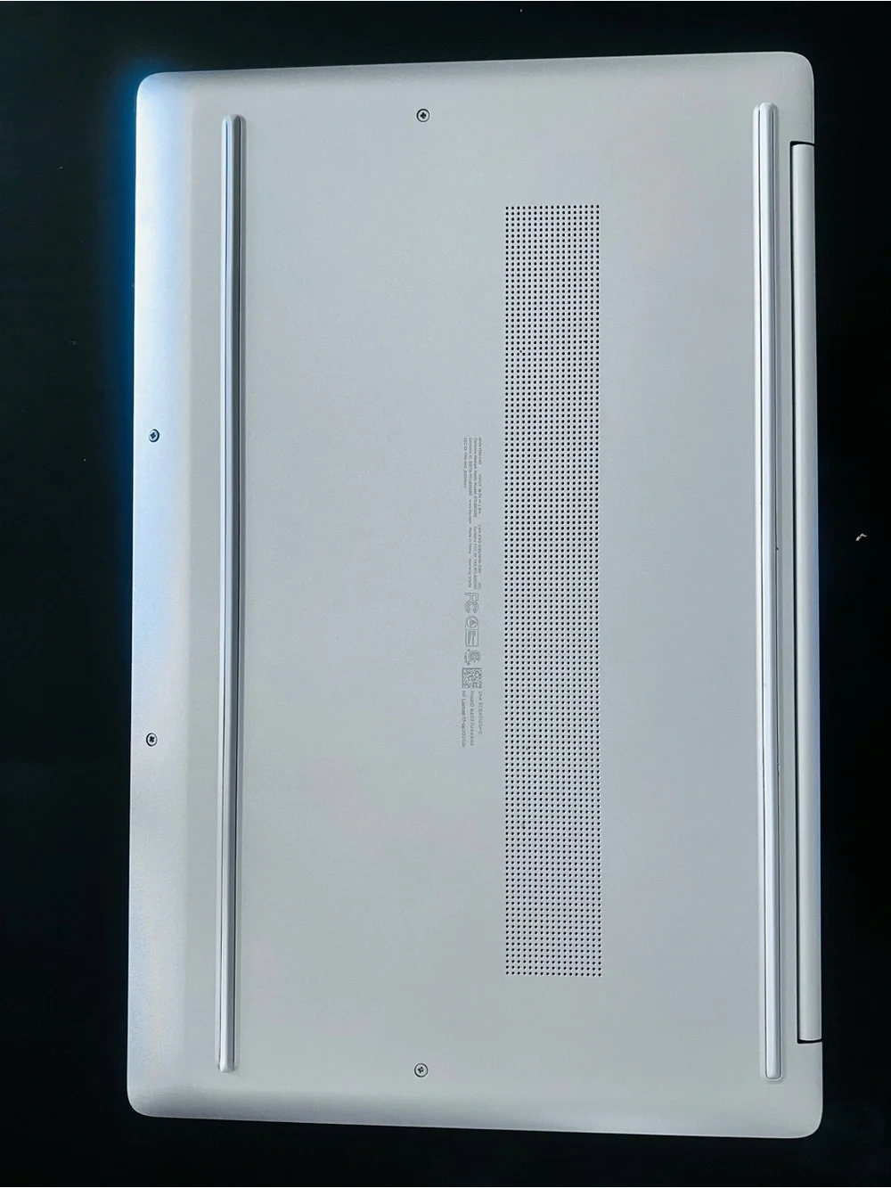 HP Silver Laptop with Blue Display and Dark Gray Keycaps